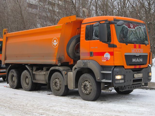Четырехосный самосвал MAN